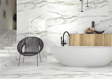 With its richly decadent white background and elegant veining, the body of this porcelain slab is an ultimate classic. . Calacatta porcelain tile 24x48